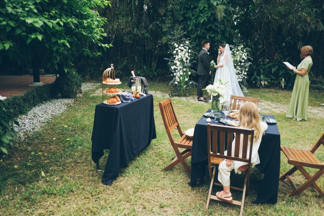 Outdoor wedding ceremony with guests seated