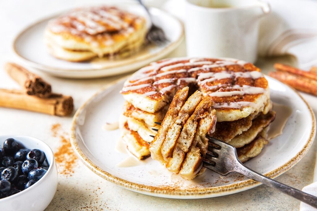 Sour Cream Cinnamon Roll Pancakes with Maple Coffee Glaze.