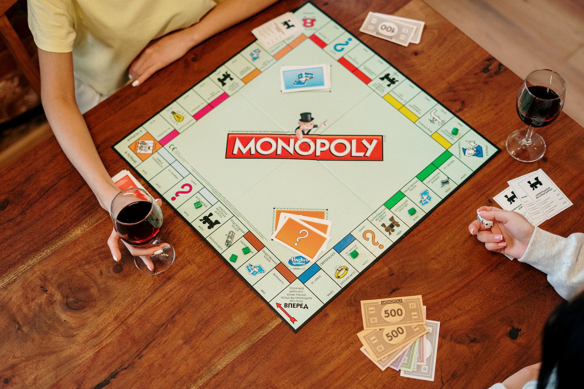 monopoly board game on brown wooden table
