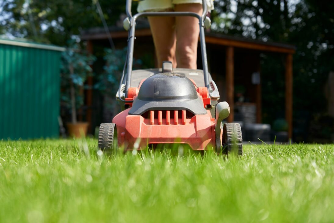 A person is mowing the lawn.